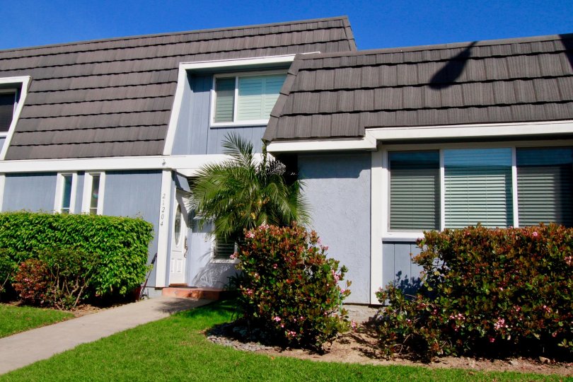 A blue residential building in Mariners Cove Community.