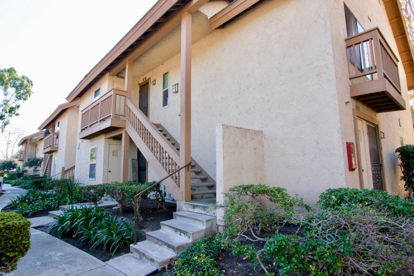 a pleasant day in the orangetree lake condos with a building that has steps in center with garden both side