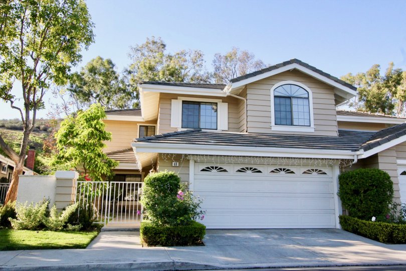 Tall trees, bushes present side to the entrance of villa in Ridge GArden Homes