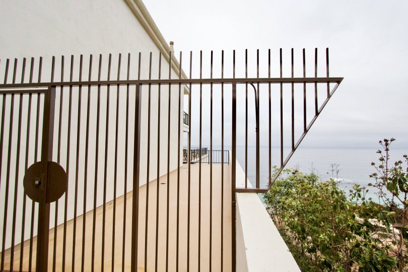 Metal fence overlooking the beach in Laguna Royale, Laguna Beach, California