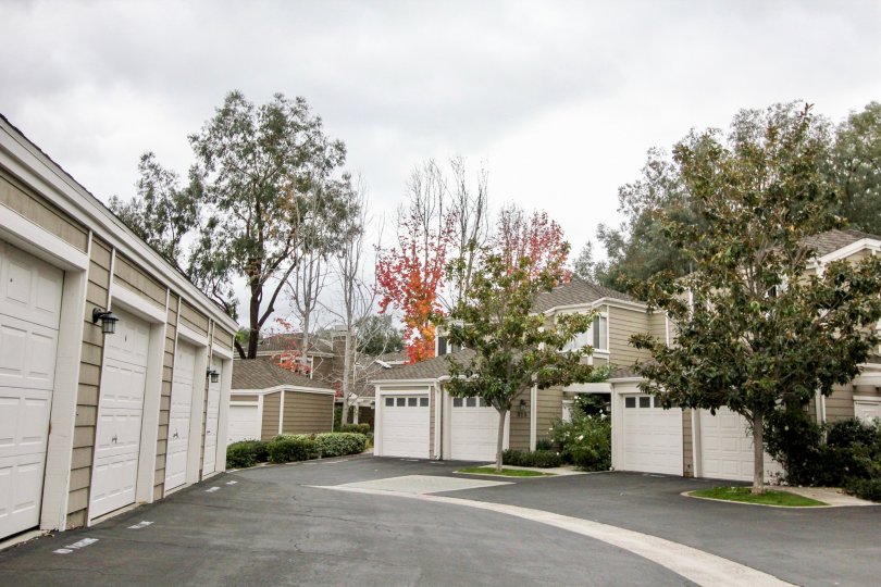Cloudy sky with apartments and garages and trees in the Terraces at Canyon Hills Community in the Laguna Beach, CA.