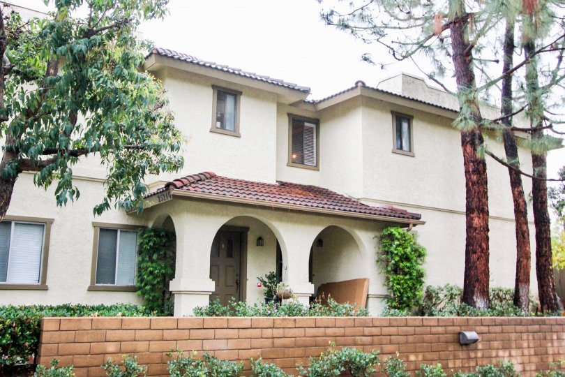 Hedges and brick wall at Tierra Vista in Lake Forest, CA