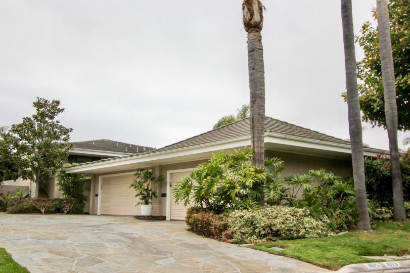 THE VILLAS IN THE GRANVILLE WITH THE FLOWER POT, LAWN, PLANTS, TREES