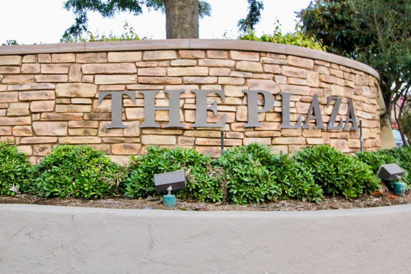 A PARK IN THE The Plaza WITH THE PLAZA WALL, PLANTS, LIGHTS, TREES