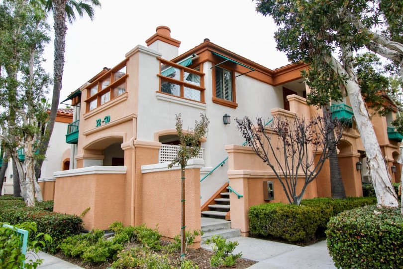 a warm day in the villa point with house that has short steps and garden around