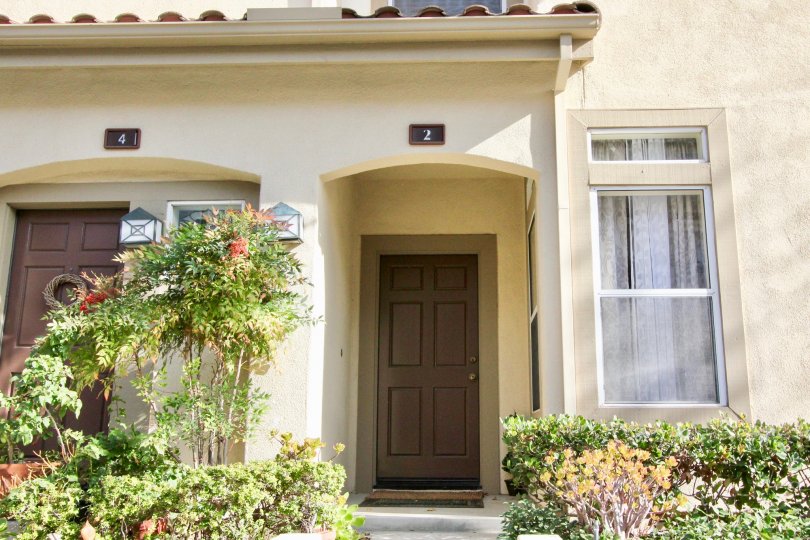 A brown wreath sits on the brown door on the left at Cabo Vista condos