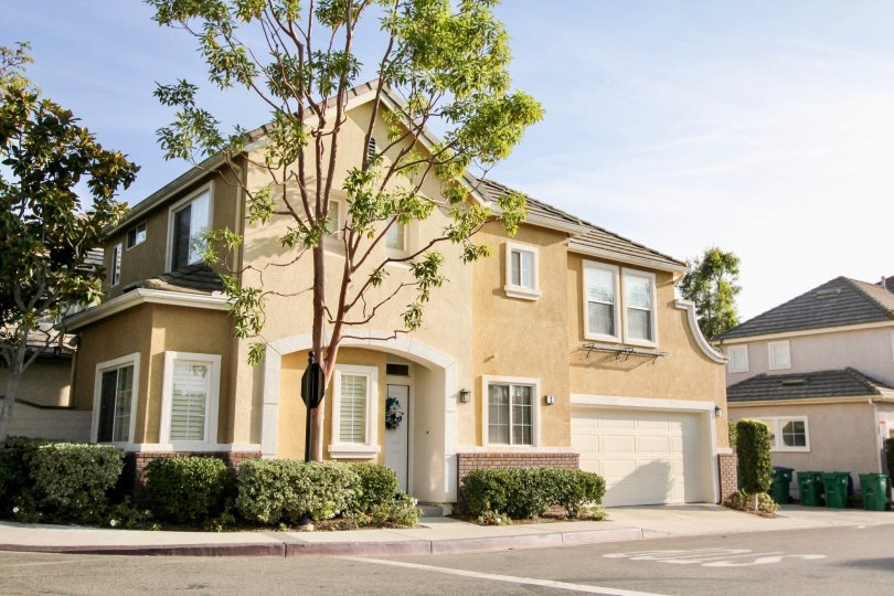 A large two story tan home with garage in Magnolia community in Rancho Santa Margarita, California.