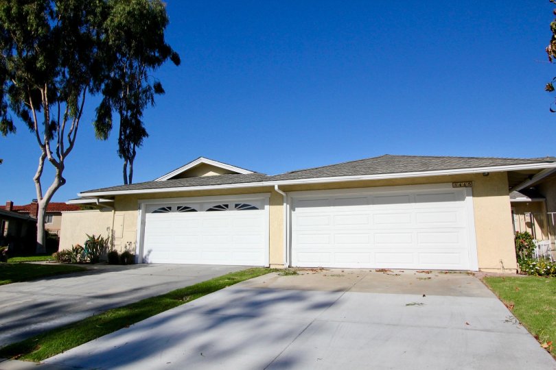 Two car parking individual separation at the same building with cream color walls in Seascape Village.