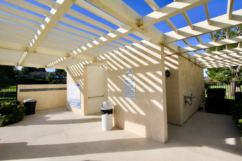 A white wood bathroom outside in Mesa Verde community in San Juan Capistrano, California.