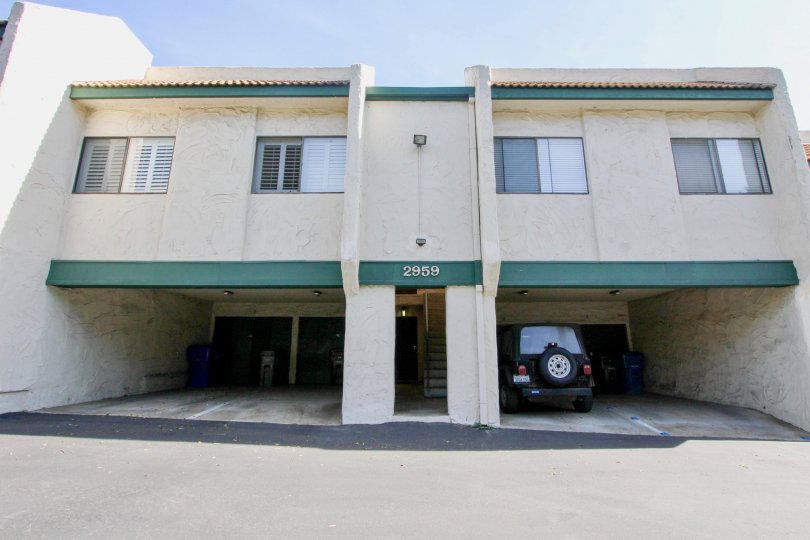 A two-storey building in Forest Park Plaza with ground-level parking.
