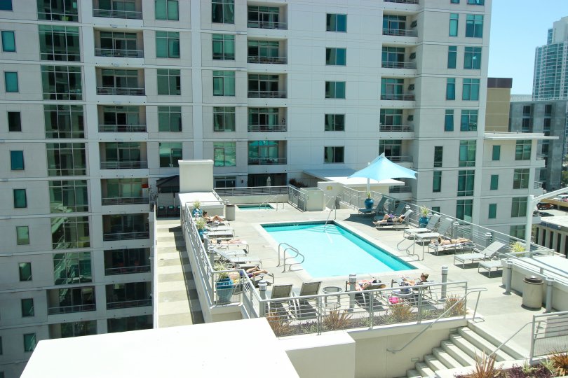 The Acqua Vista high rise condominium with a sun-drenched roof top pool in downtown San Diego, California