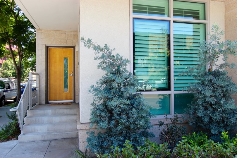 Residence with a wood & glass door inside Acqua Vista at Downtown San Diego CA