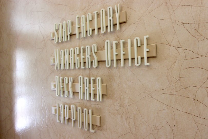 Sign for Soap Factory, Manager's Office, Deck Area, and Lap Pool for Cityfront Terrace in Downtown San Diego, California