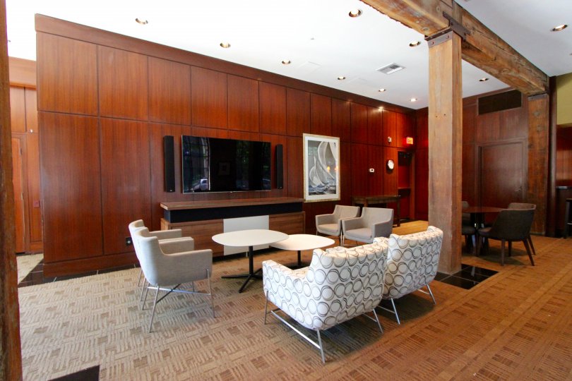 Wooden wall separation in the middle of the area with sofa decoration in Cityfront Terrace.