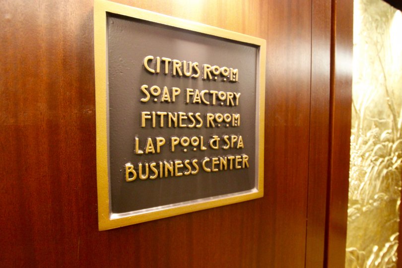 A sign for the Citrus Room, Soap Factory, Fitness room, Lap pool & spa and business center in City front terrace
