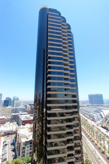 Tall glass residential high rise at Harbor Club in Downtown San Diego CA