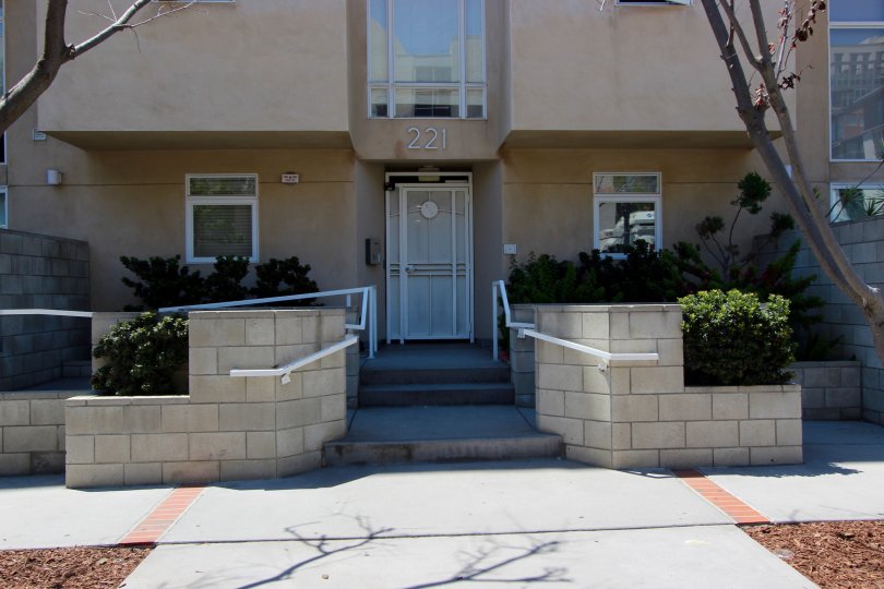 Front view of the building decorated with plants in Island Lofts