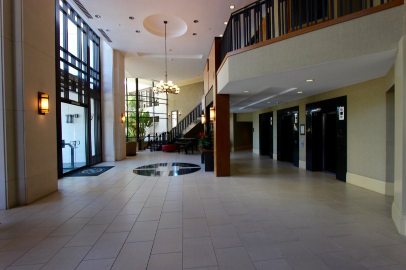 The lobby in the Park Place community with tiled floor and stairway