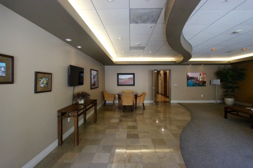 Office area with tv, chairs and tables in the Porto Siena community