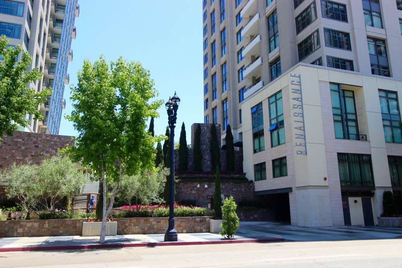A sunny day in the area of Renaissance, outside, condo, tree, light pole, sidewalk, street