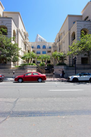 Cars parked on the street in front of Watermark in downtown San Diego, CA