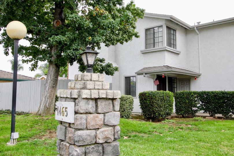 VERY BEAUTIFUL HOUSE. IN FRONT OF IT THERE IS A LAWN. GREENERY IS EVERY WHERE.