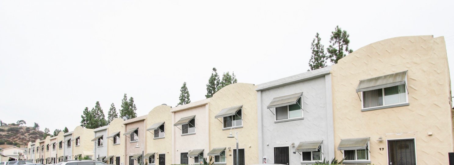 Long line of units both clay color and white in the community the Galleria.