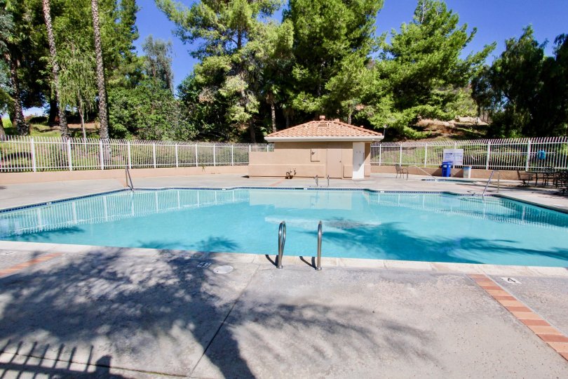 Outer view of pool area in The Knolls with view of swimming pool.