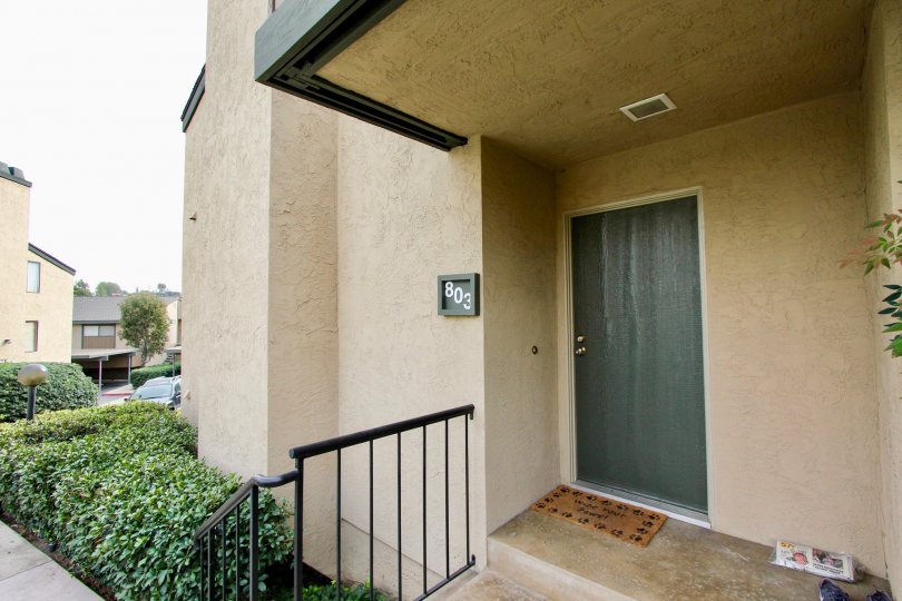 the front entrance of Parkway Manor with lots of lush green plants around