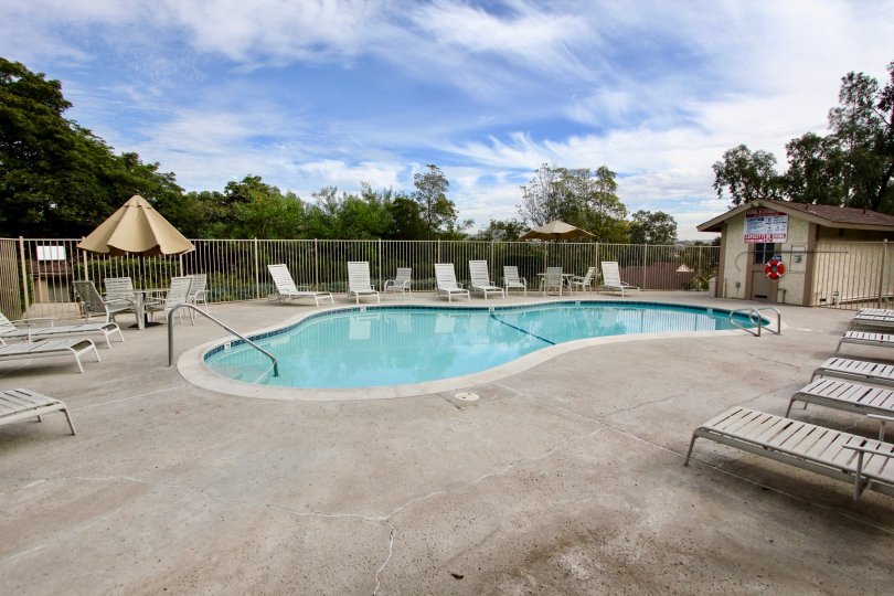 The Strawberry Hills with a swimming pool and chairs around
