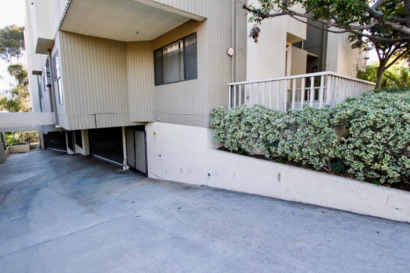 4055 Eagle apartment unit in Mission Hills, CA. Contains sloping driveway to two garages. Sunny day.