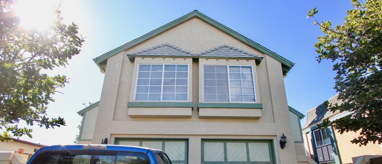 View of pictures windows on second story apartment at Norman House II in Normal Heights, Ca.