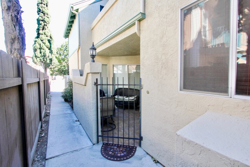 A black iron gate with spikes at Norman House III in Normal Heights CA