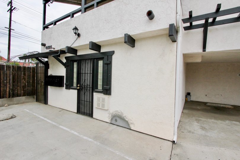 A sunny day in the area of 4185 Louisiana Street, condo, gated door, parking area