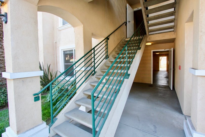 A small yard by stairs leading to a unit in La Costa Villas in Oceanside, CA