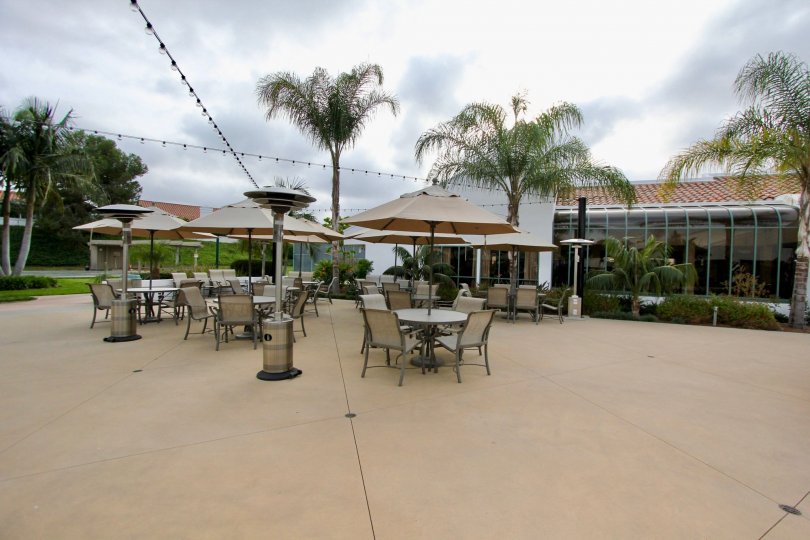Sit by the palm trees on this patio in Oceanside, California