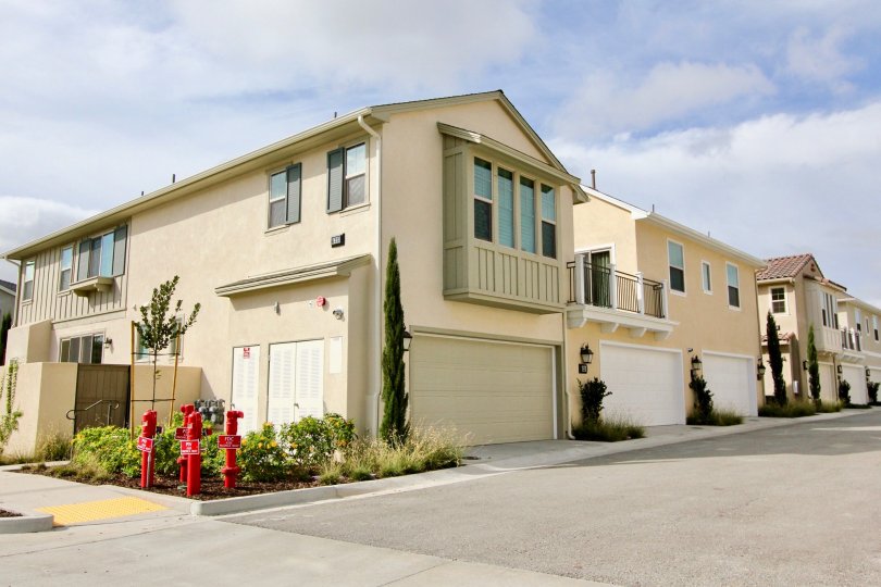 Street view of the building decorated with plants and trees in St Cloud at Ocean Ranch