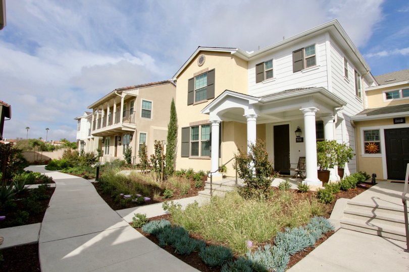 Beautiful front entries with porches for friends at St Cloud at Ocean Ranch.