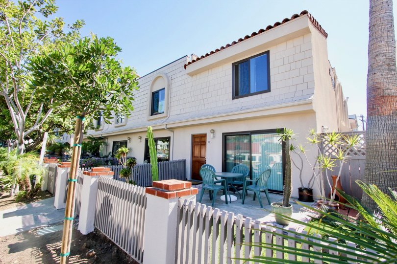 Street - level decks with trees and seating in at Santa Barbara Community in Pacific Beach, CA