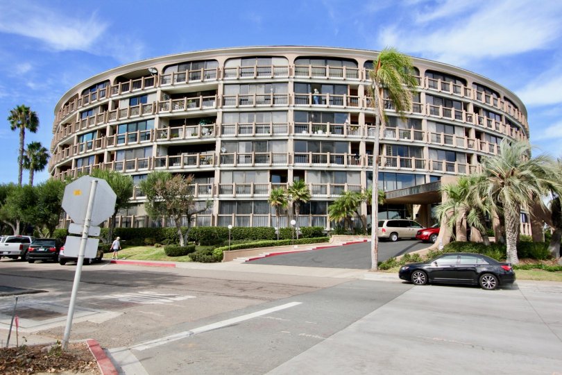 Retro style building exterior located next to major roadway with ample lawn space and trees and unobstructed views of the surroundings at Le Rondelet
