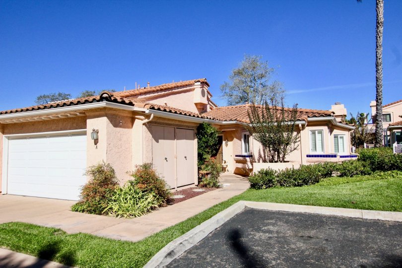 Pink units with grass and trees inside Masters Hill in Rancho Bernardo CA