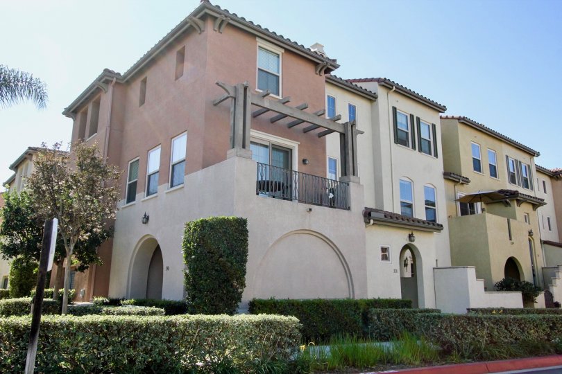 A sunny day in the Coronado Ranch neighborhood with several homes nearby