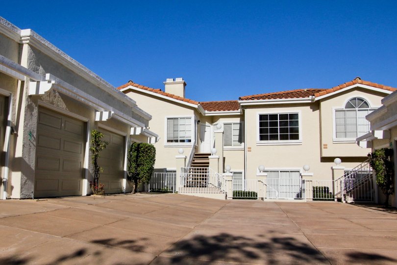 Two story housing with large black windows inside Panorama in San Marcos CA