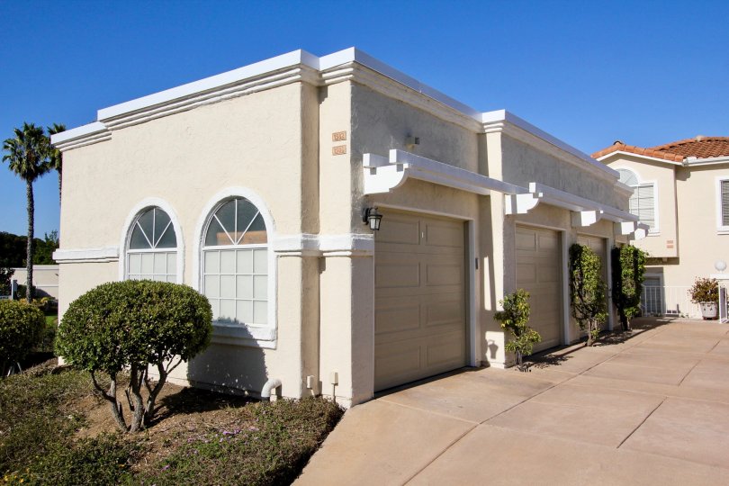 Bright sunny day with trees and parking place of villas in Panorama of San Marcos