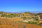 Fantastic estates scatter the golden rolling hills of the rural West Murrieta neighborhood